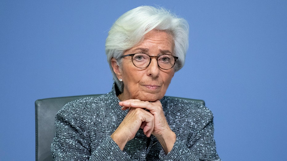 Christine Lagarde with her hands folded under her chin