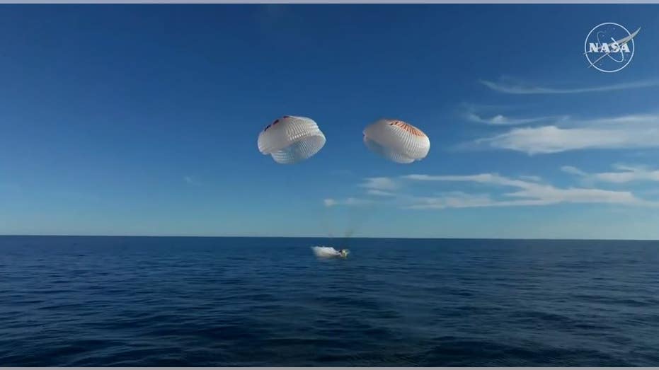 SpaceX Dragon capsule landing in water