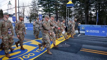 Massachusetts National Guard members kick off the 128th Boston Marathon