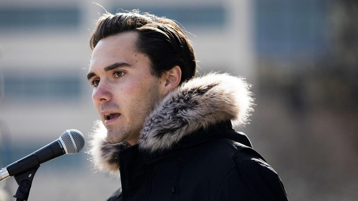David Hogg at microphone, closeup shot